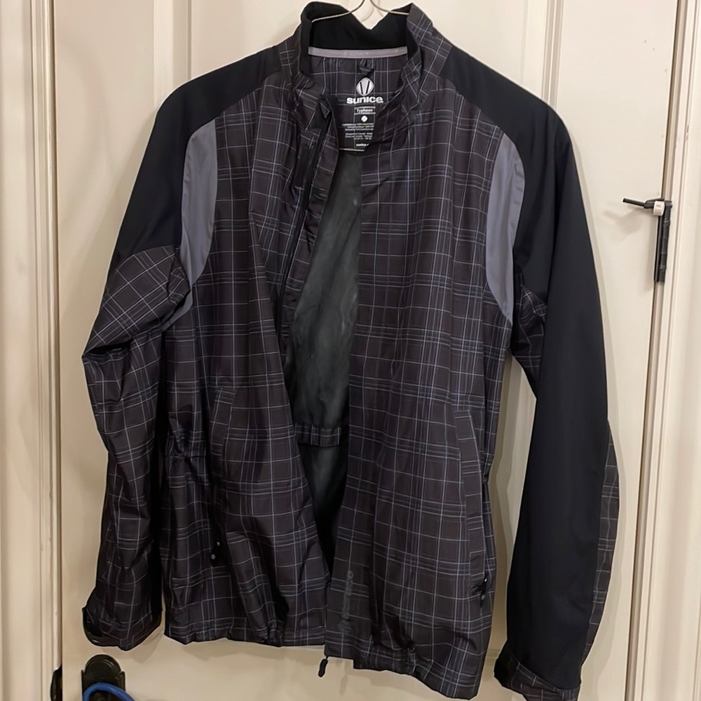 Sunice golf rain jacket size L only worn a couple of times . Black and grey